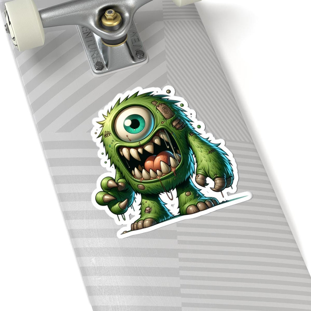 Green cyclops monster vinyl sticker with bold fangs and wild fur for laptop customization — view 2
