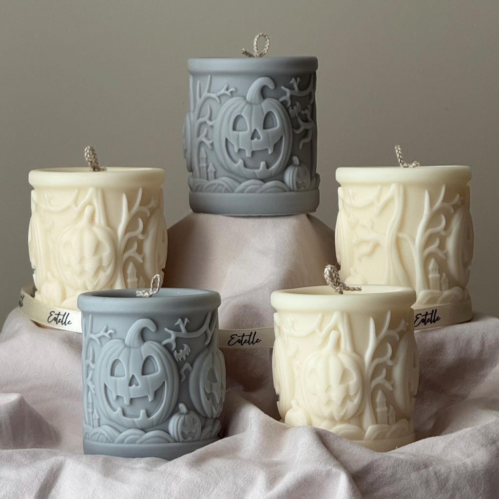 Scary pumpkin pillar candle made of soy blend wax in autumn home decor setting — view 4