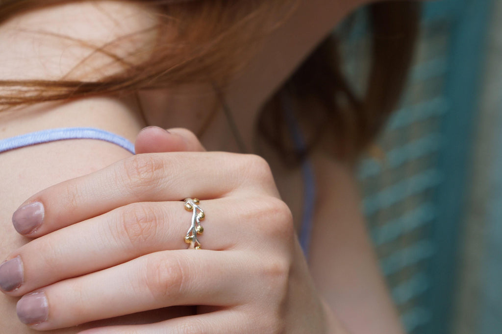 Handmade gold acacia ring crafted from recycled sterling silver featuring intricate botanical leaf vein details