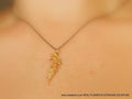 Gold-plated acacia leaf pendant necklace on an adjustable black rhodium-plated sterling silver chain.