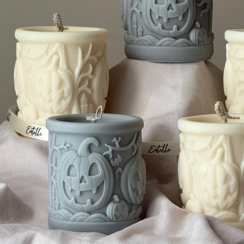 Scary pumpkin pillar candle made of soy blend wax in autumn home decor setting — view 3