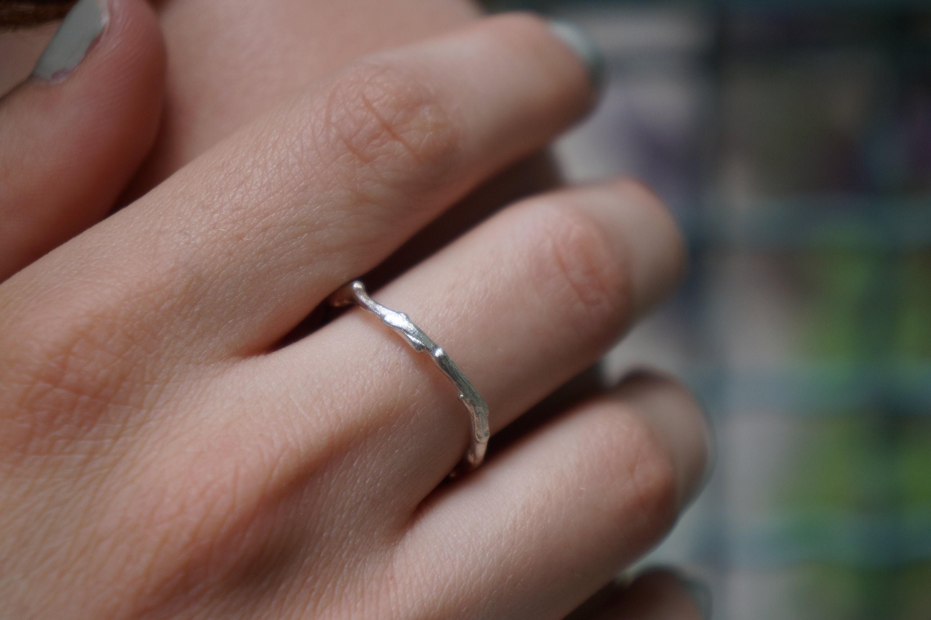 Sterling silver olive branch ring featuring a delicate thin band inspired by natural botanical elements