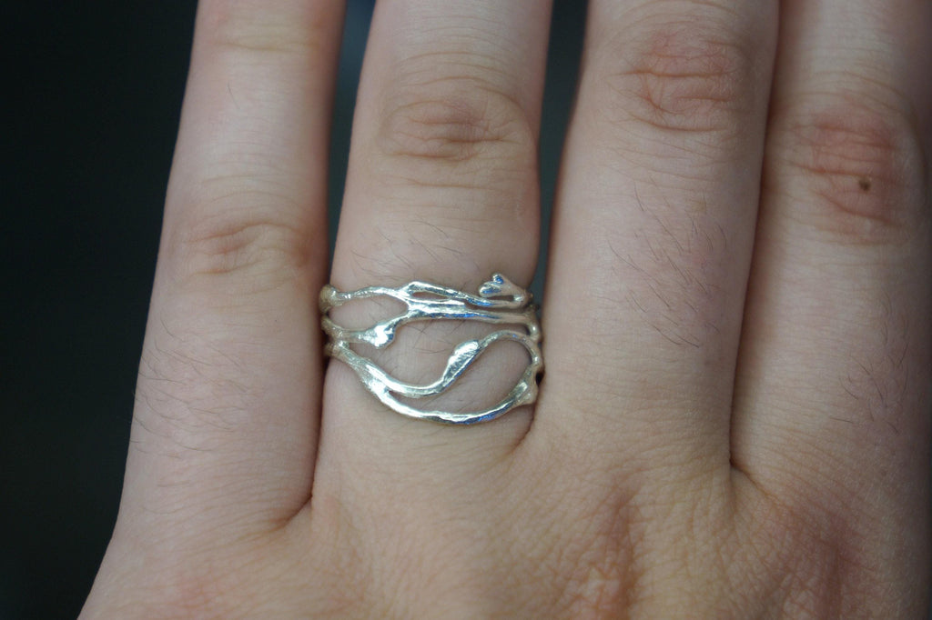 Gold-plated silver jasmine twig ring showcasing delicate botanical textures and organic branch details