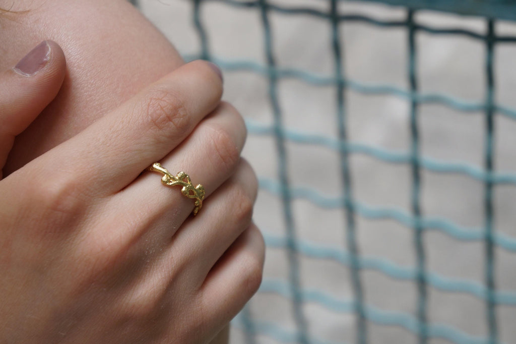 Handmade gold acacia ring crafted from recycled sterling silver featuring intricate botanical leaf vein details — view 4
