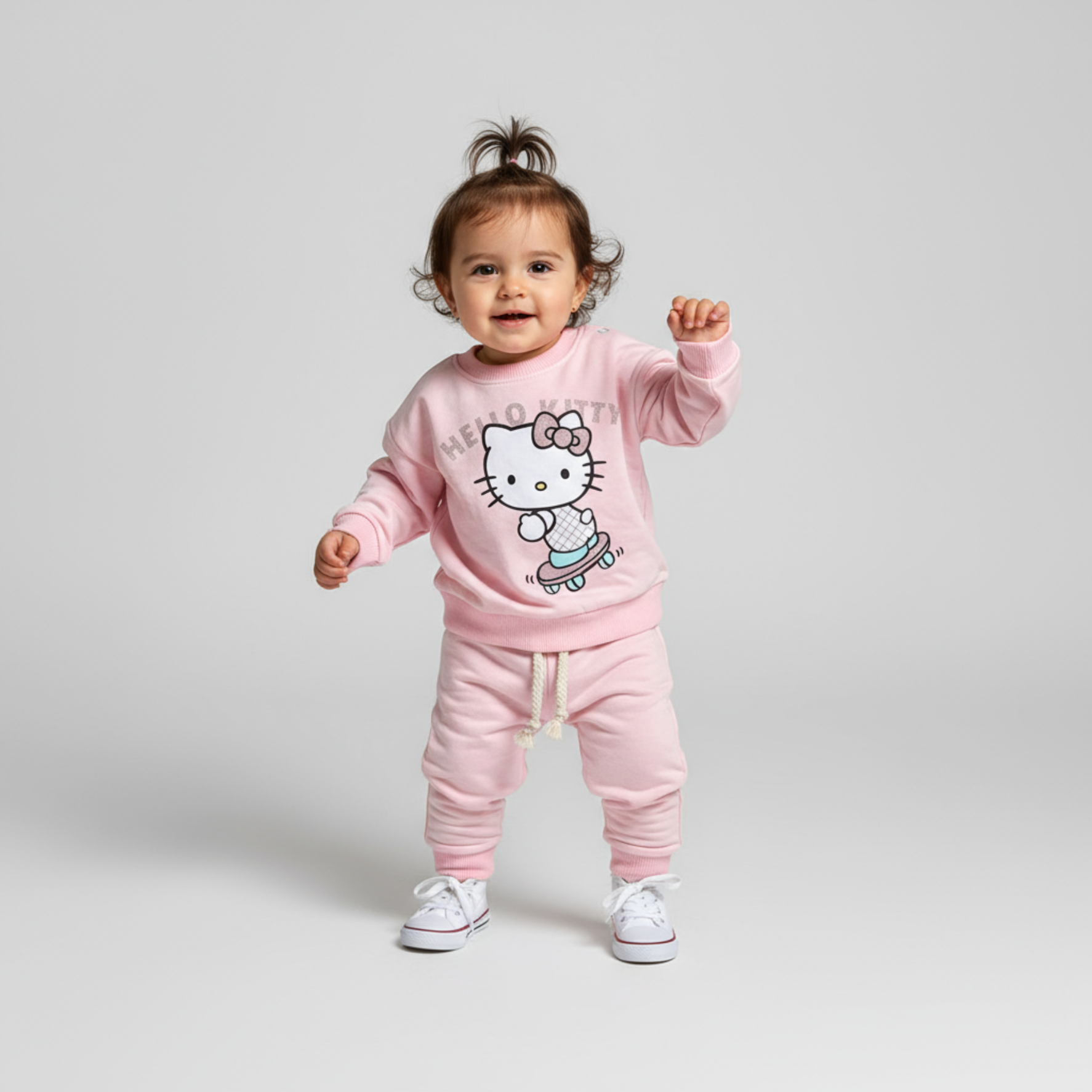Girls Hello Kitty jogger set in soft pink cotton featuring crewneck sweatshirt and matching drawstring pants
