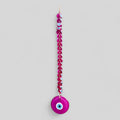 Pink evil eye wall hanging decor with 41 handblown glass beads and intricate macrame detailing.