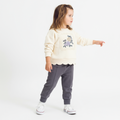 Cotton two-piece baby girls jogger set featuring floral embroidery, scalloped hem, and elastic waist pants.