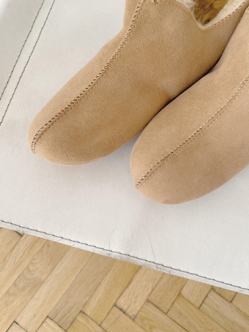 Beige adult natural sheepskin boots with genuine leather sole on a clean background — view 5