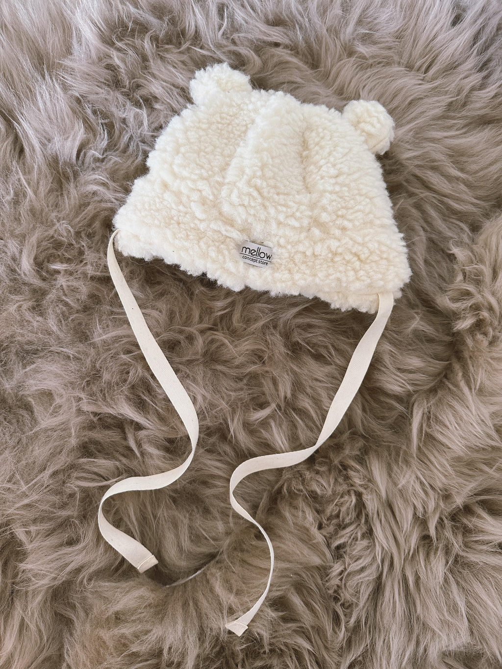 Polar white woolen baby hat with teddy texture, bear ears, and long secure tie strings — view 5