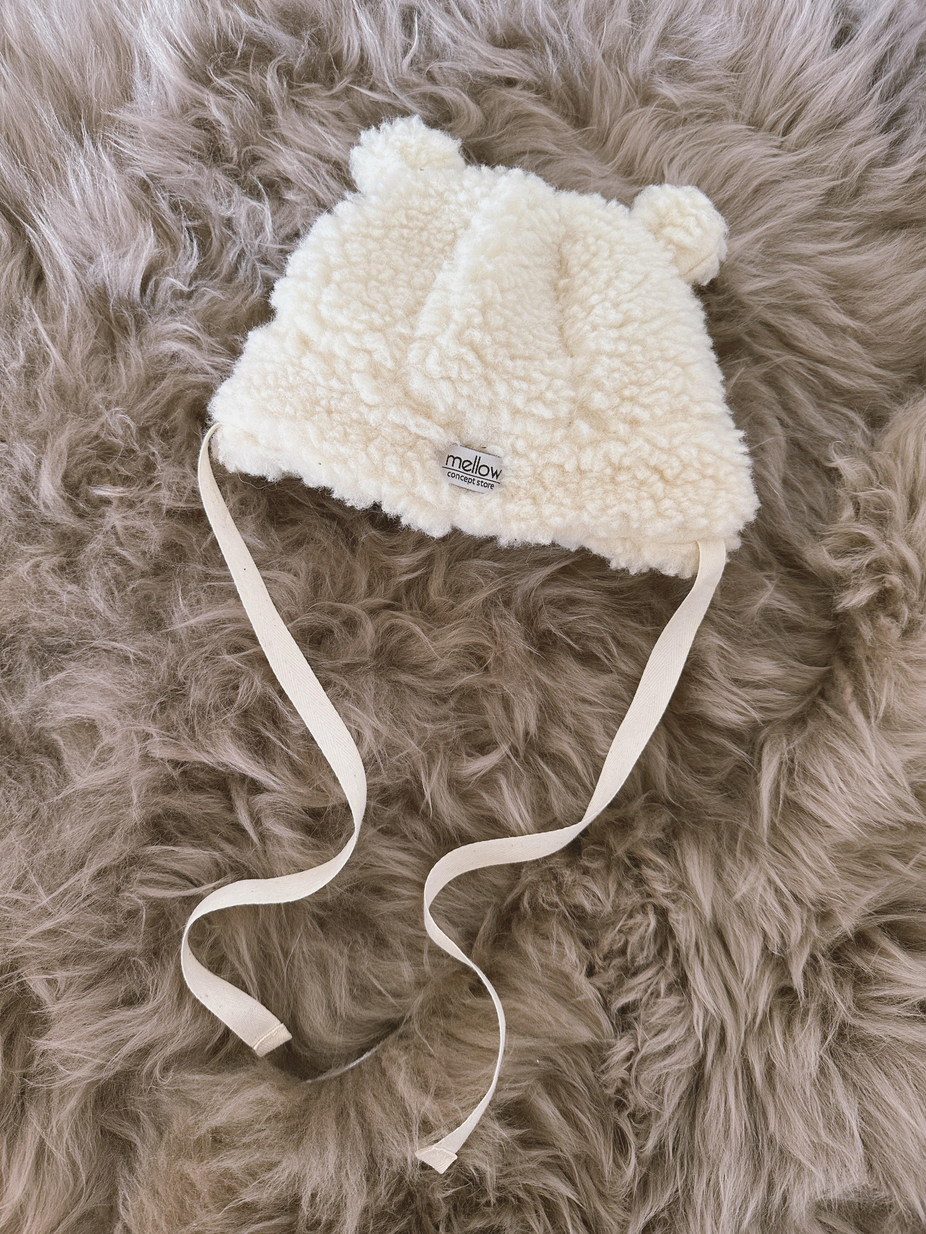 Polar white woolen baby hat with teddy texture, bear ears, and long secure tie strings — view 5