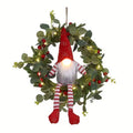 Illuminated Christmas gnome wreath with LED lights and Santa Claus design for indoor holiday decor