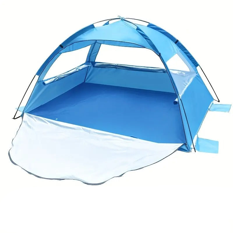 Blue pop-up beach tent sun shelter with extendable footprint and mesh windows on sand.
