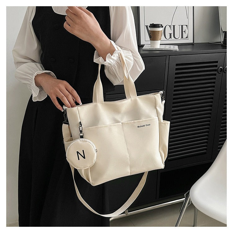 Beige waterproof Oxford tote bag with crossbody strap and exterior flap pocket — view 5