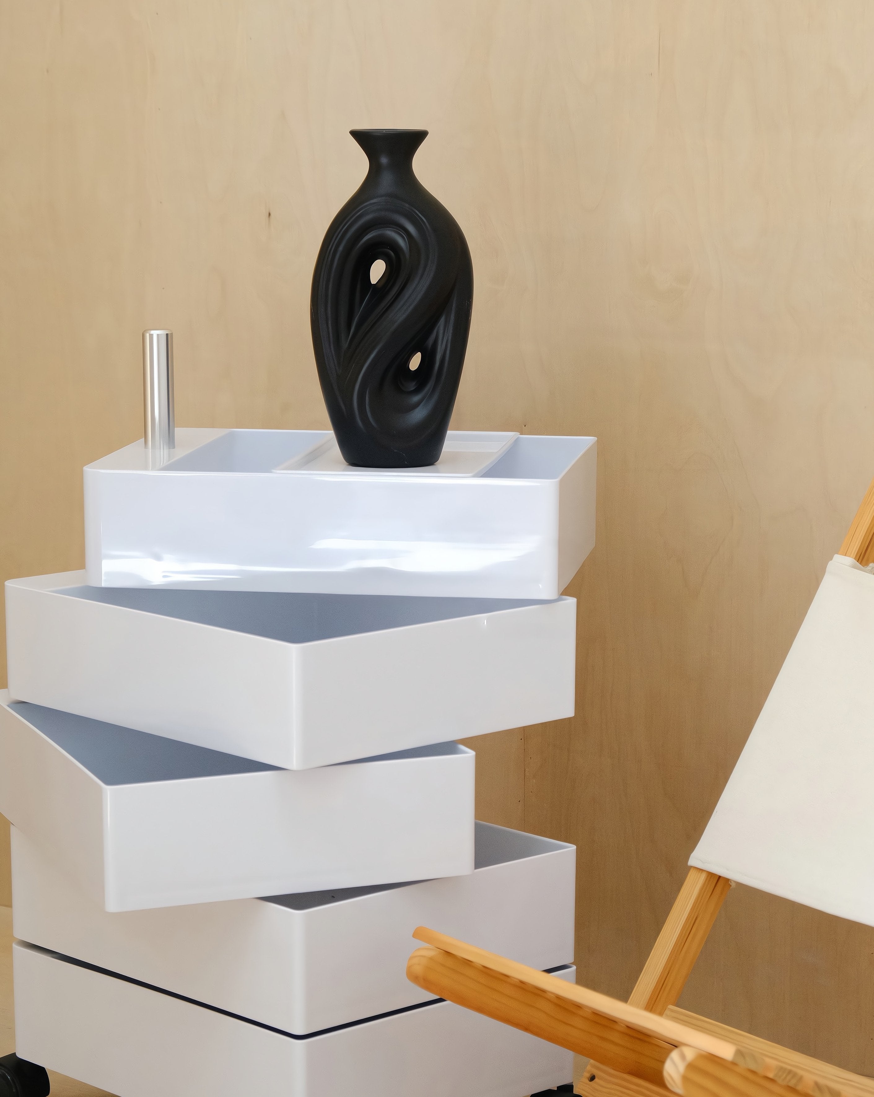 Handmade contemporary abstract black ceramic flower vase with an irregular decorative shape — view 4