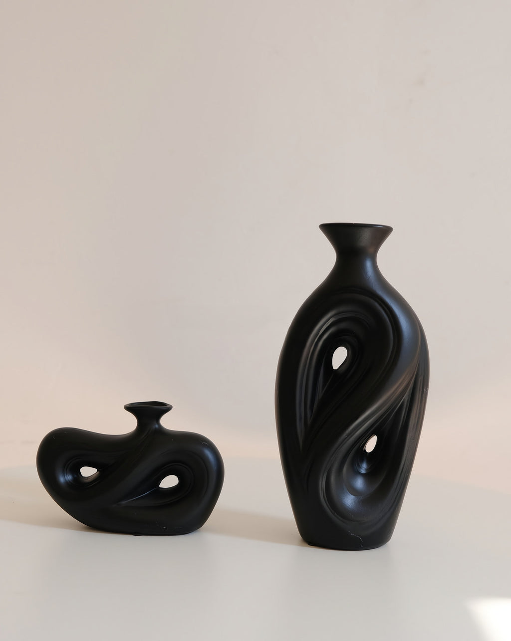 Handmade contemporary abstract black ceramic flower vase with an irregular decorative shape — view 3