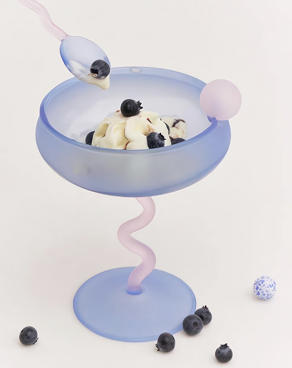Colorful mouth-blown Jelly Bean cocktail coupe glasses displayed on an elegant festive dining tabletop. — view 5