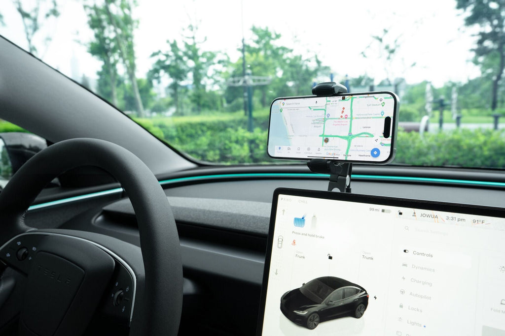 Invisible foldaway Qi2 wireless car charger mounted behind a touchscreen with adjustable metal arm — view 4
