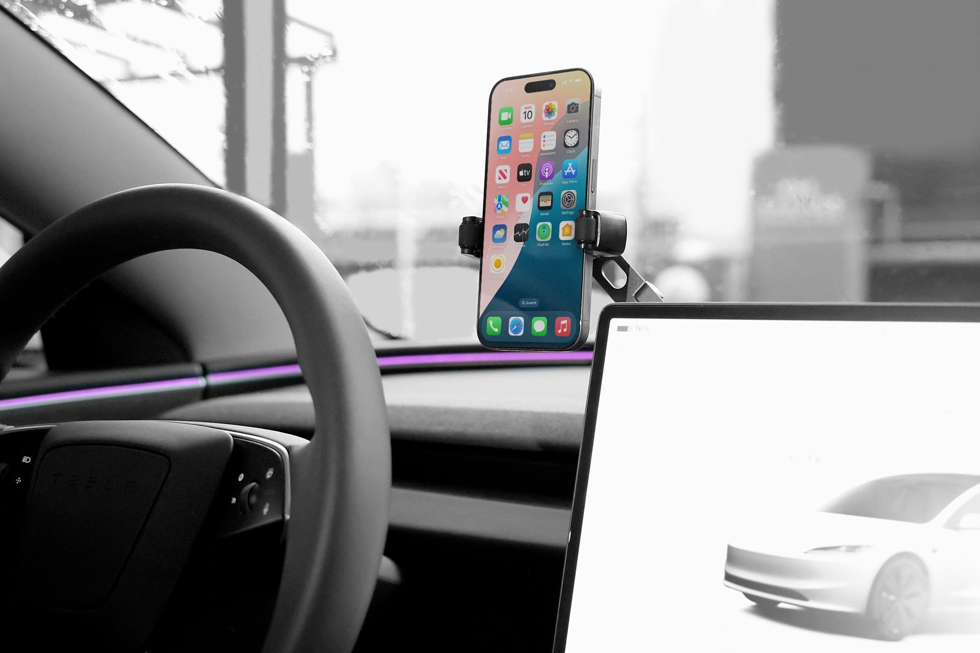 Retractable foldaway car mount with adjustable metal arm and silicone clamp holding a smartphone — view 5