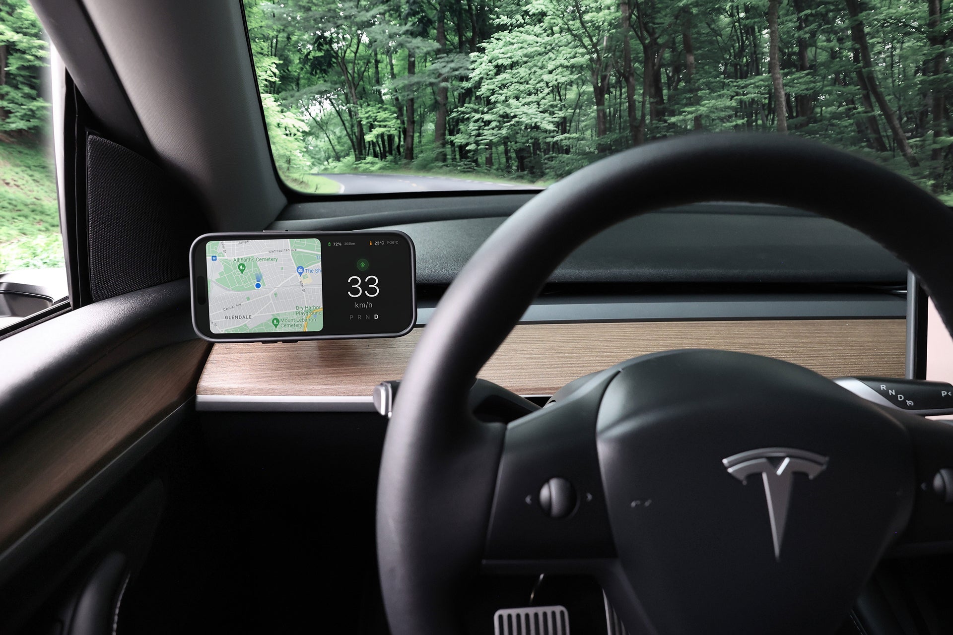 Active cooling MagSafe wireless car mount with vent clip attached to a Tesla dashboard — view 5