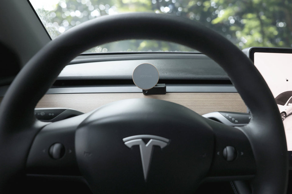 Active cooling MagSafe wireless car mount with vent clip attached to a Tesla dashboard — view 4