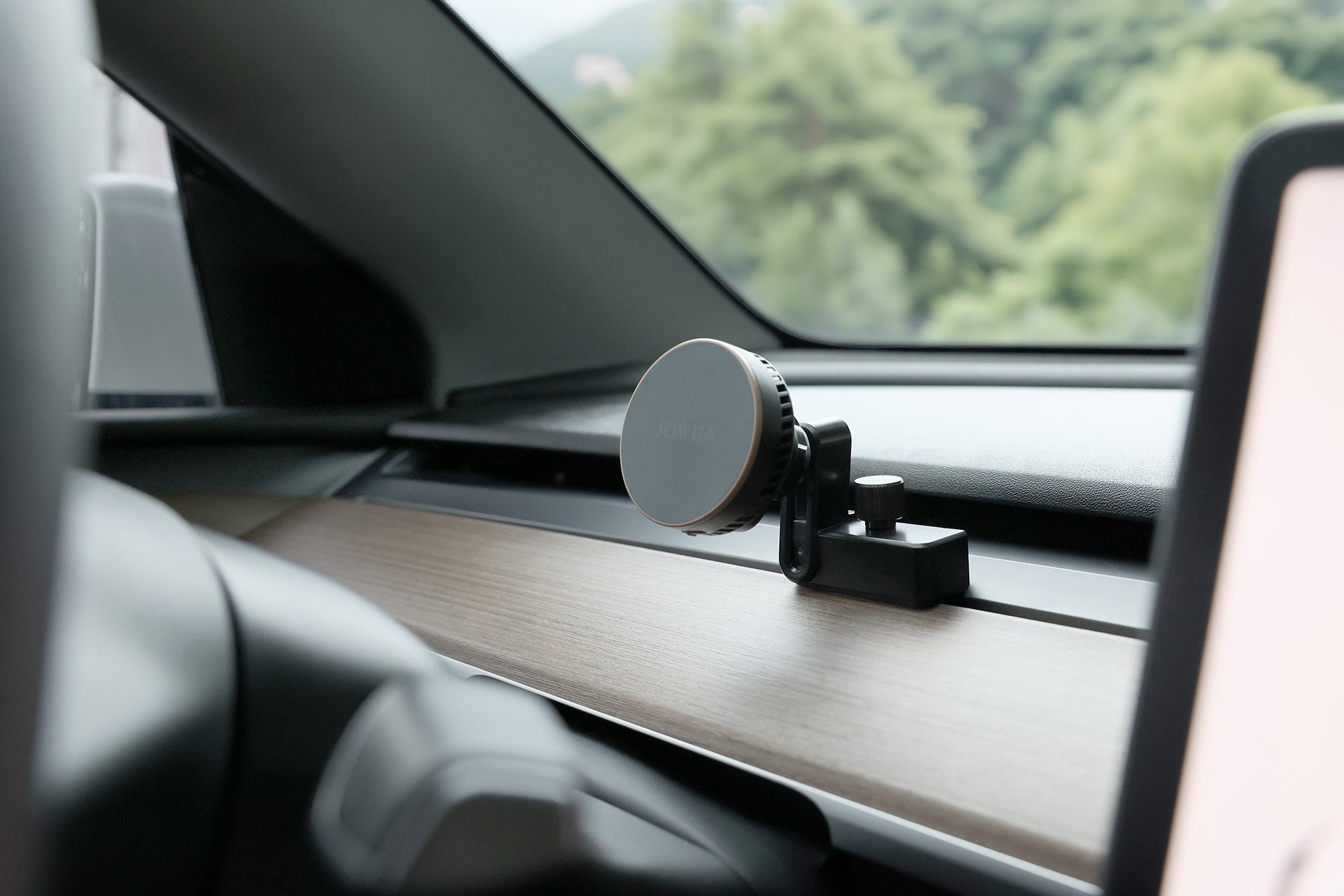 Active cooling MagSafe wireless car mount with vent clip attached to a Tesla dashboard — view 2