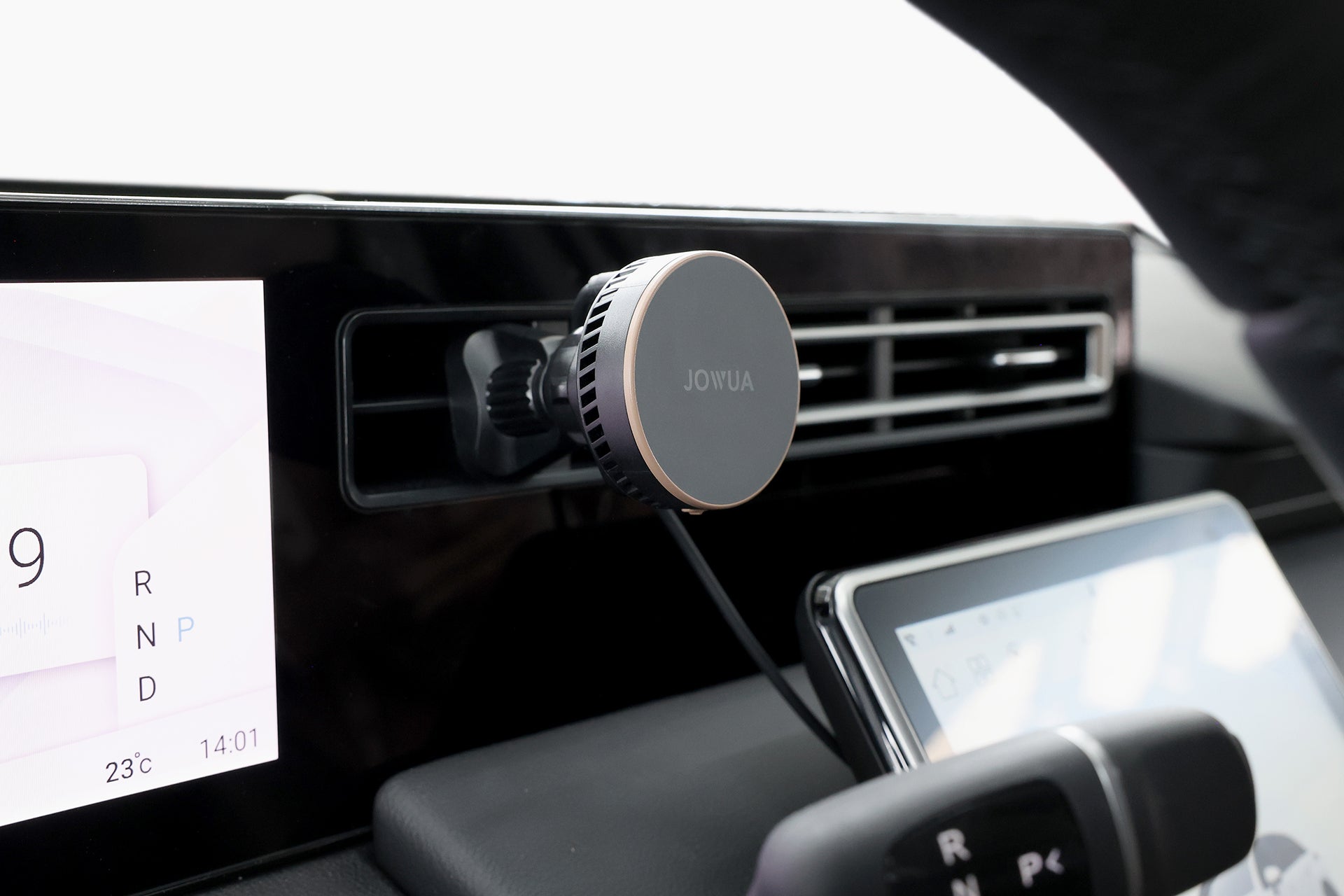 Active cooling MagSafe car mount attached to air vent with a smooth silicone surface. — view 3