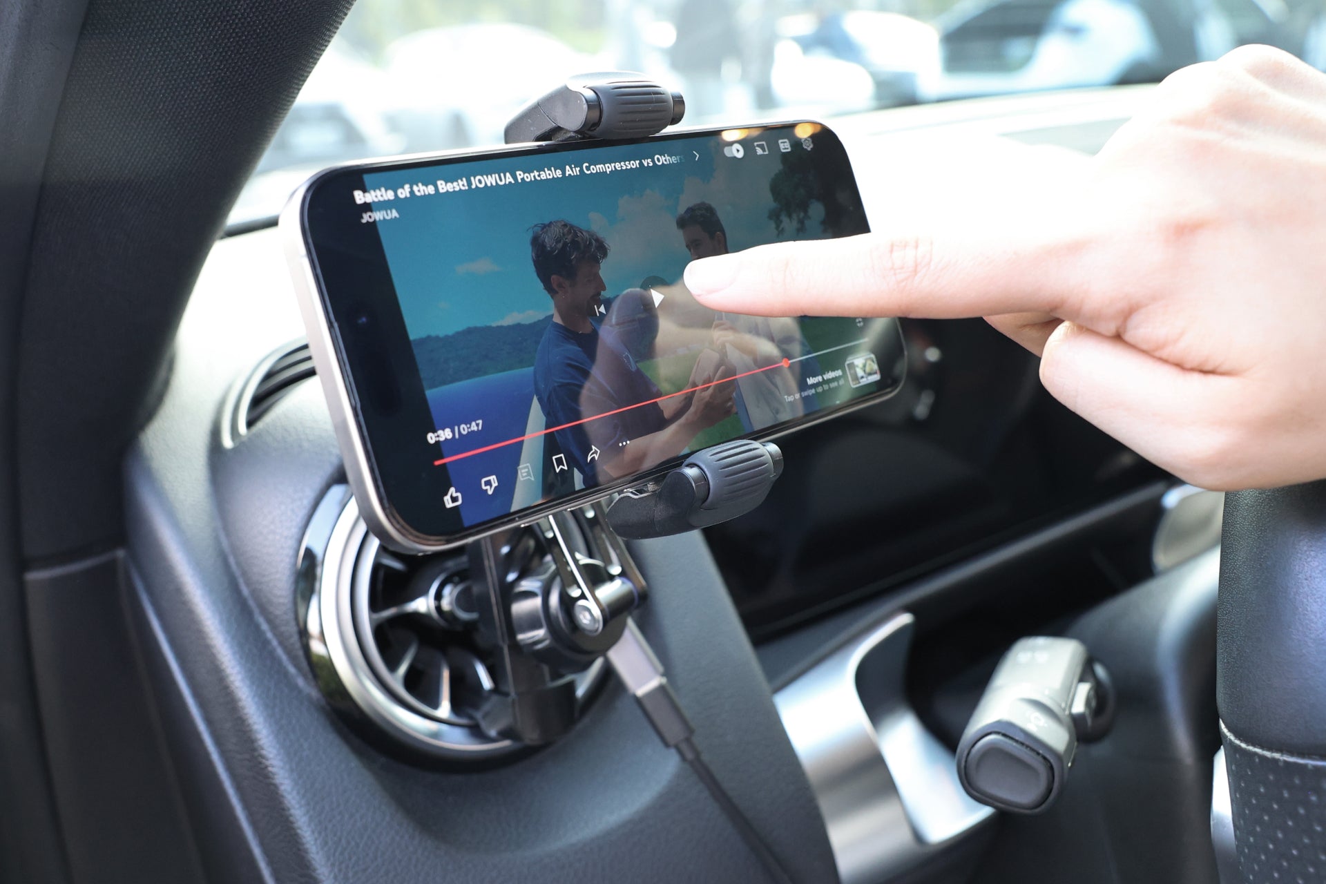 Universal Qi2 wireless car air vent mount with silicone roller clamps and adjustable arm — view 4