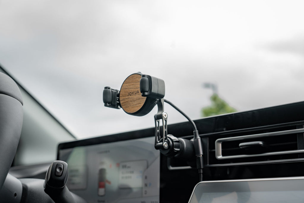 Universal Qi2 wireless car air vent mount with silicone roller clamps and adjustable arm — view 3