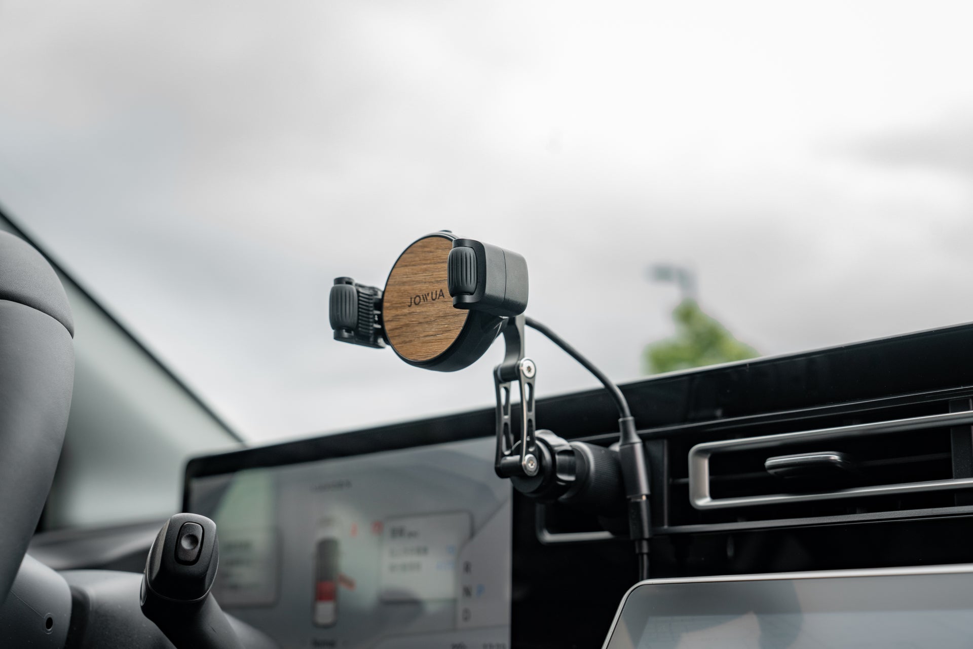 Universal Qi2 wireless car air vent mount with silicone roller clamps and adjustable arm — view 3
