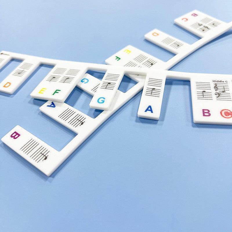 Multicolour silicone removable piano keyboard note labels placed on black and white keys — view 4
