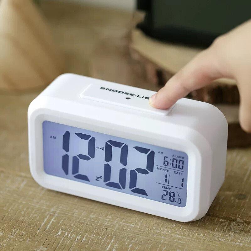 Modern digital bedside alarm clock with temperature display and LED night light in crisp white. — view 3