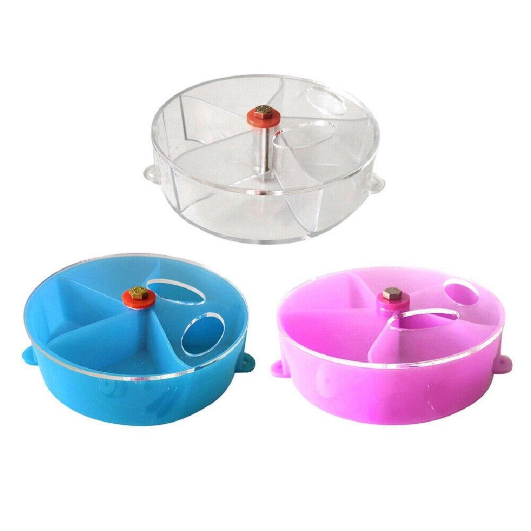 Interactive parrot foraging wheel toy in purple, mounted securely to a bird cage with clear compartments — view 2