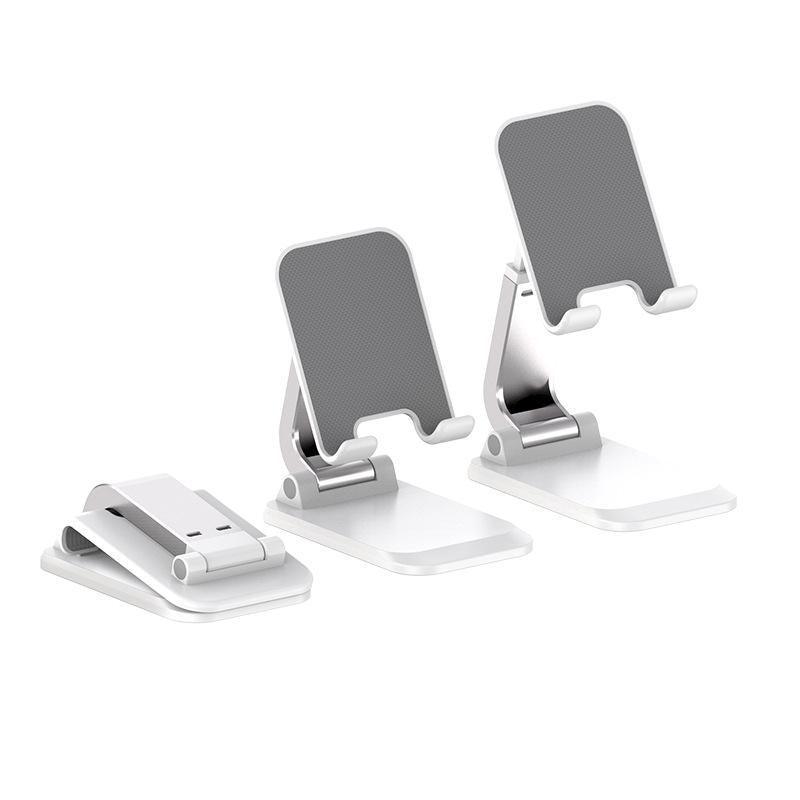 Adjustable foldable tablet stand in silver aluminum securely holding a mobile phone on a desk — view 5