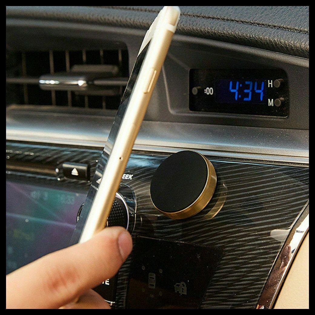 Compact magnetic car phone holder mounted on a dashboard, showcasing its slim 7mm profile. — view 5
