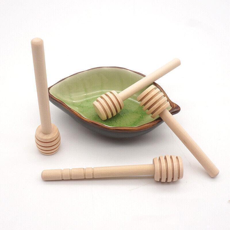 Mini wooden honey dipper sticks with carved grooves arranged together for drizzling syrup and party favors — view 5