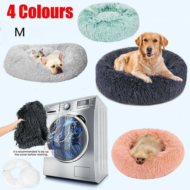 Calming plush round pet bed in soft fabric with waterproof base and washable zipper cover