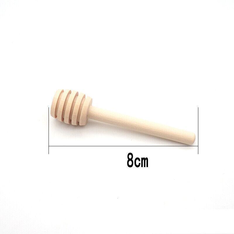 Mini wooden honey dipper sticks with carved grooves arranged together for drizzling syrup and party favors — view 3