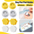 Magnetic wall mounted dog pee pad holder clips in white plastic securing a training pad