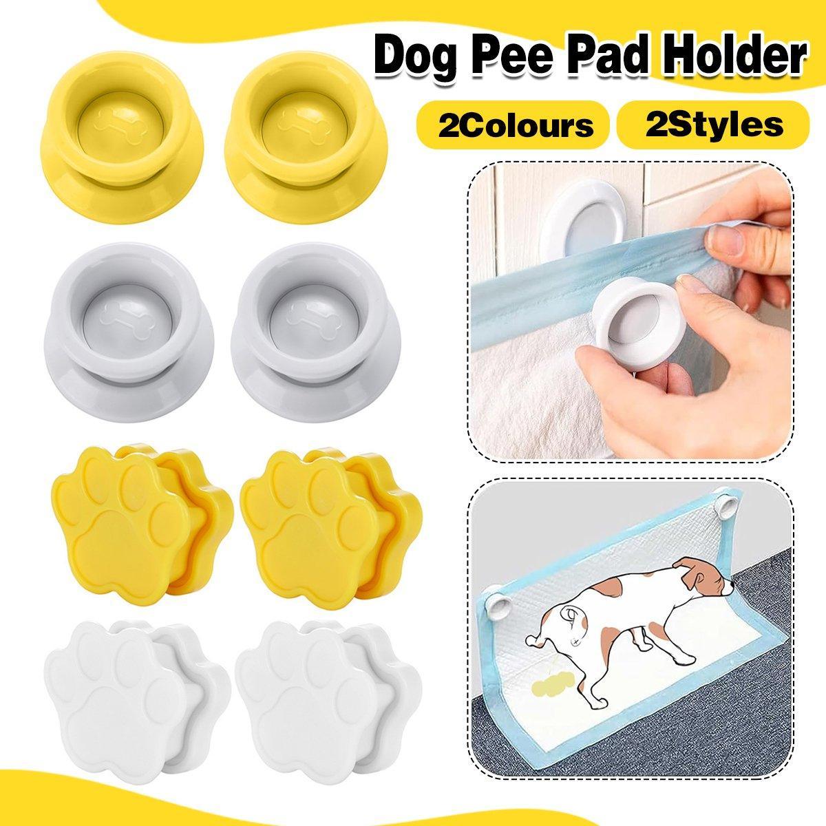 Magnetic wall mounted dog pee pad holder clips in white plastic securing a training pad