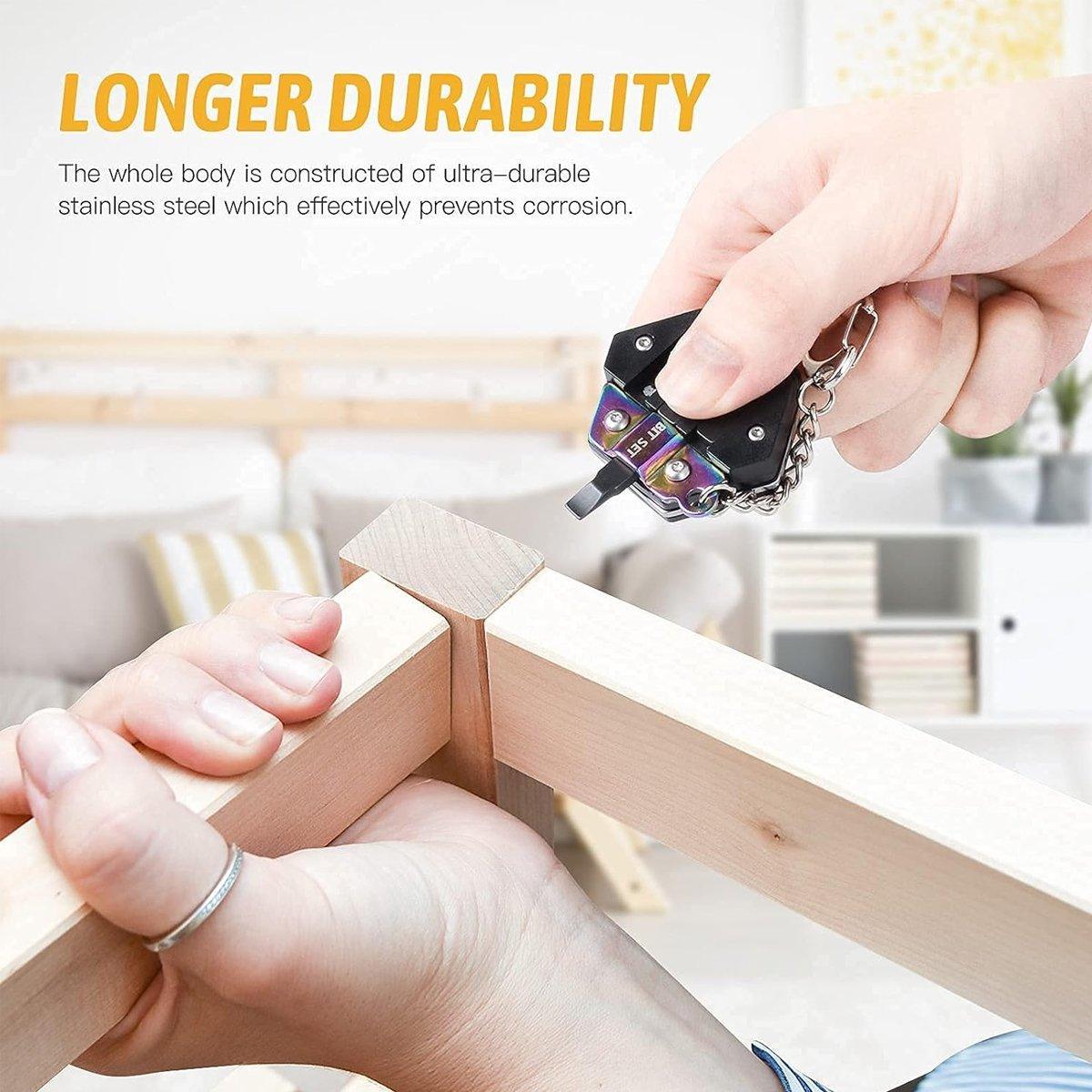 Black stainless steel hexagon pocket multitool keychain with folding knife and screwdriver bits attached — view 5