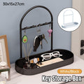 Minimalist metal and plastic entryway storage rack with key hooks and catchall tray for accessories