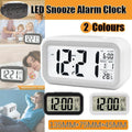 Modern digital bedside alarm clock with temperature display and LED night light in crisp white.