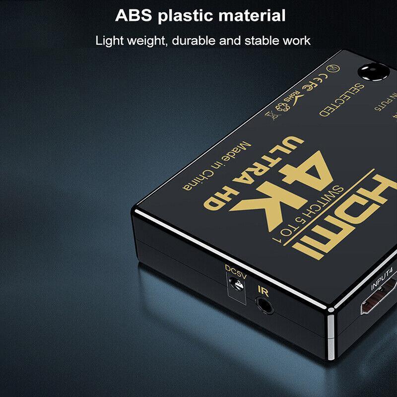 Black 4K HDMI switch and splitter in ABS housing with remote control and power cable — view 4
