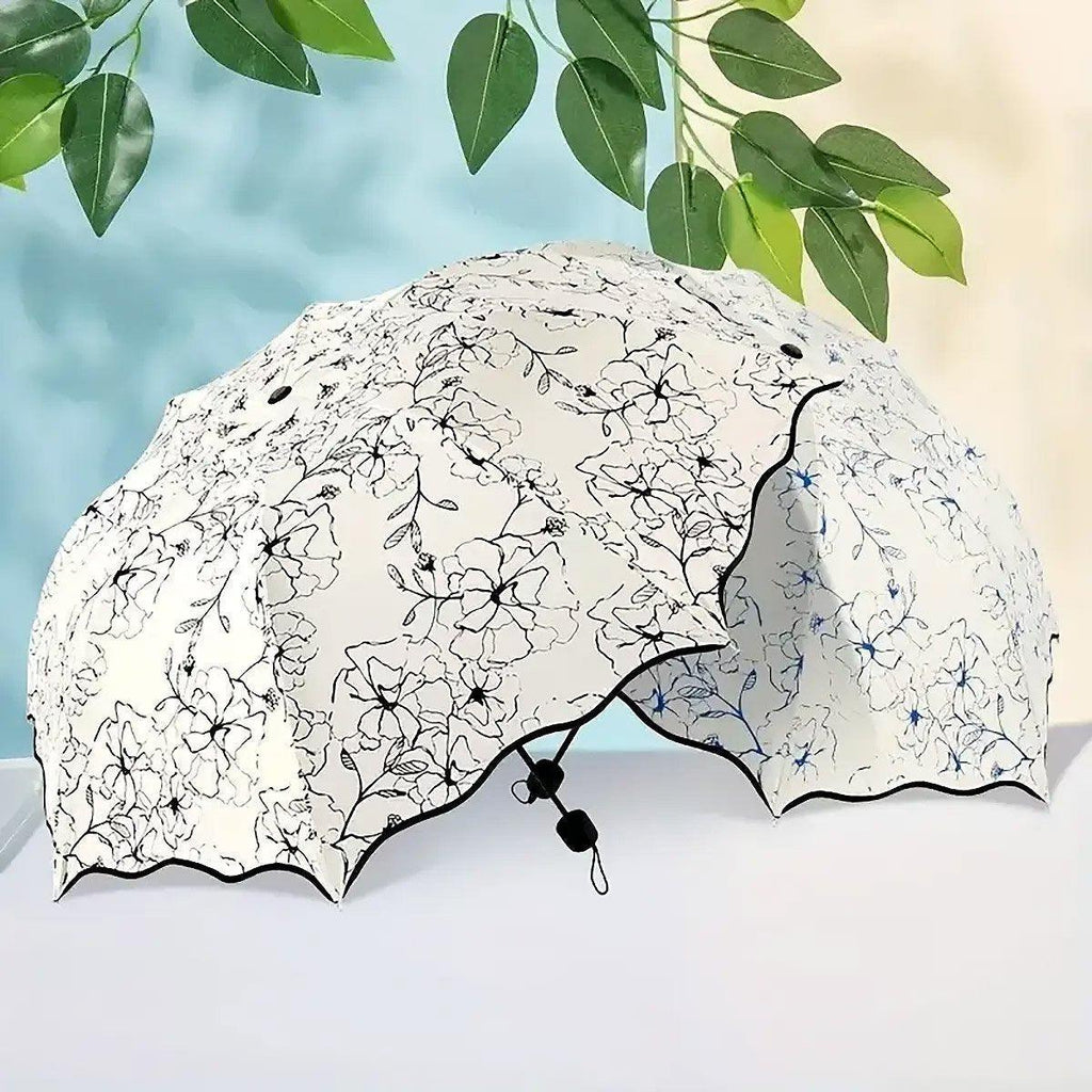 Compact floral folding umbrella with black rubber UV coating and reinforced windproof canopy frame. — view 5