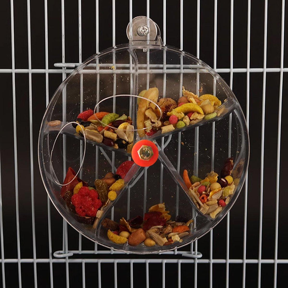 Interactive parrot foraging wheel toy in purple, mounted securely to a bird cage with clear compartments — view 5