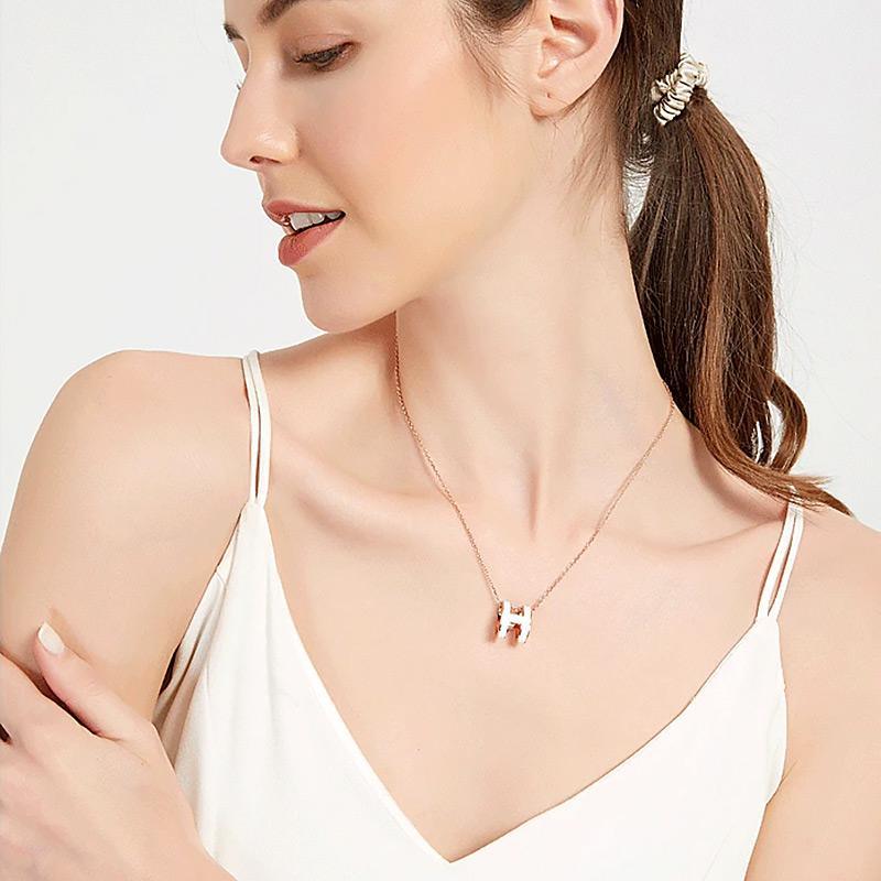 Oval enamel letter necklace in rose gold delicate clavicle chain with vibrant H initial pendant — view 4