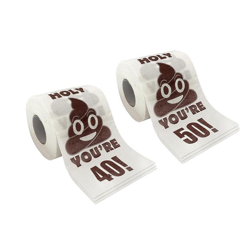 Funny milestone birthday toilet paper roll featuring a brown printed poop emoji on white paper. — view 2