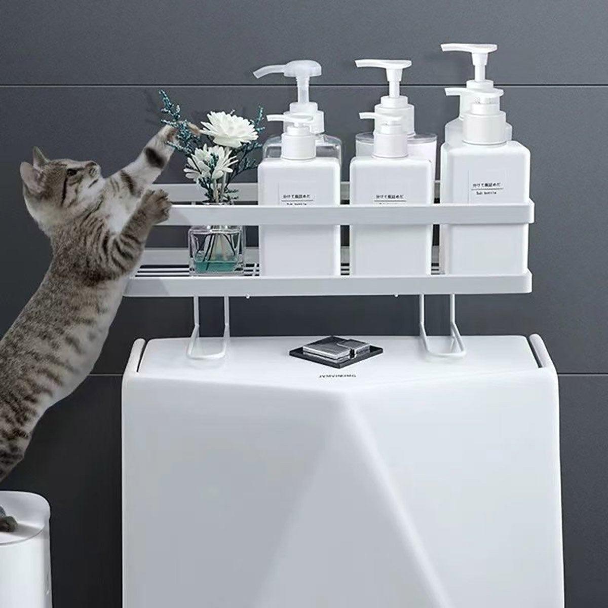 Matte black stainless steel one tier bathroom storage shelf mounted on a wall with toiletries — view 5