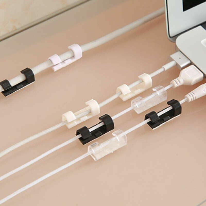 Set of twenty self-adhesive plastic cable management clips organizing power cords on a wooden desk — view 4