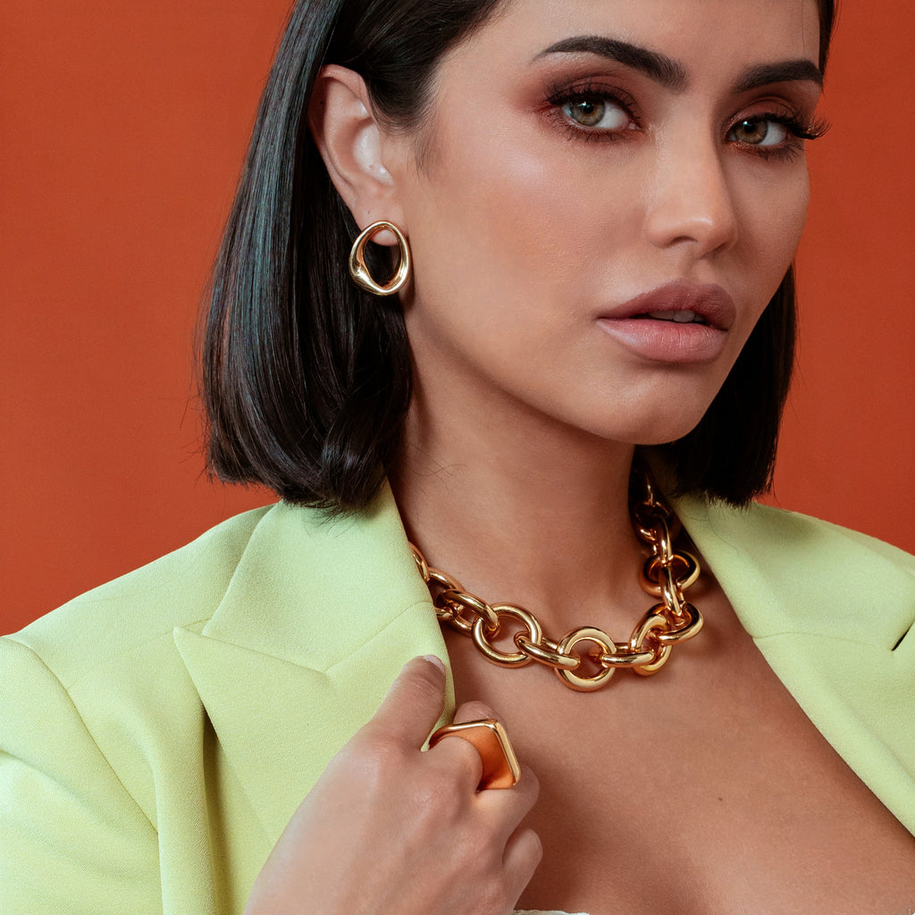 Kate abstract oval drop earrings with a smooth gold finish and fluid geometric sculptural design. — view 4